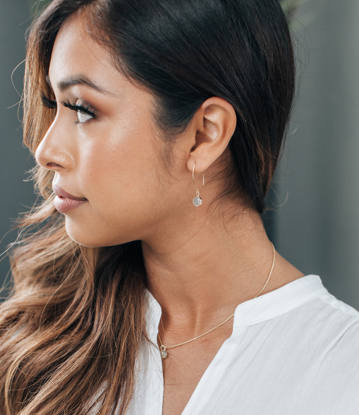 close by me jewelry's dome ashes dangle memorial earrings in sterling silver in a model's ear
