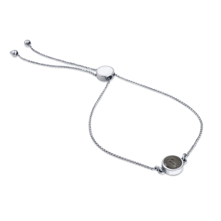Bolo Chain Cremation Bracelet in 14k White Gold shown laying down, with ashes charm