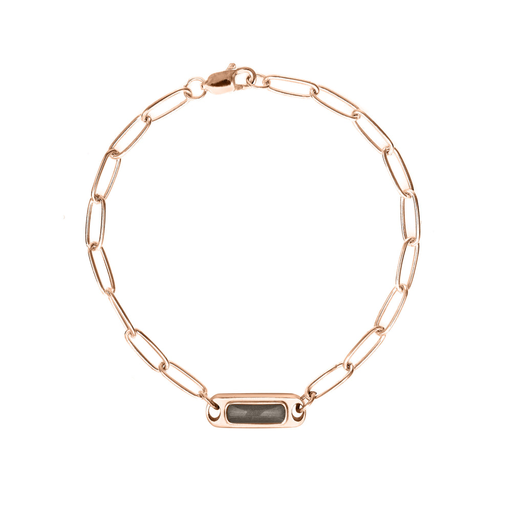 Overhead view of Close By Me's Chain Link Cremation Bracelet in 14K Rose Gold, its chain laid out in a circle and clasped.