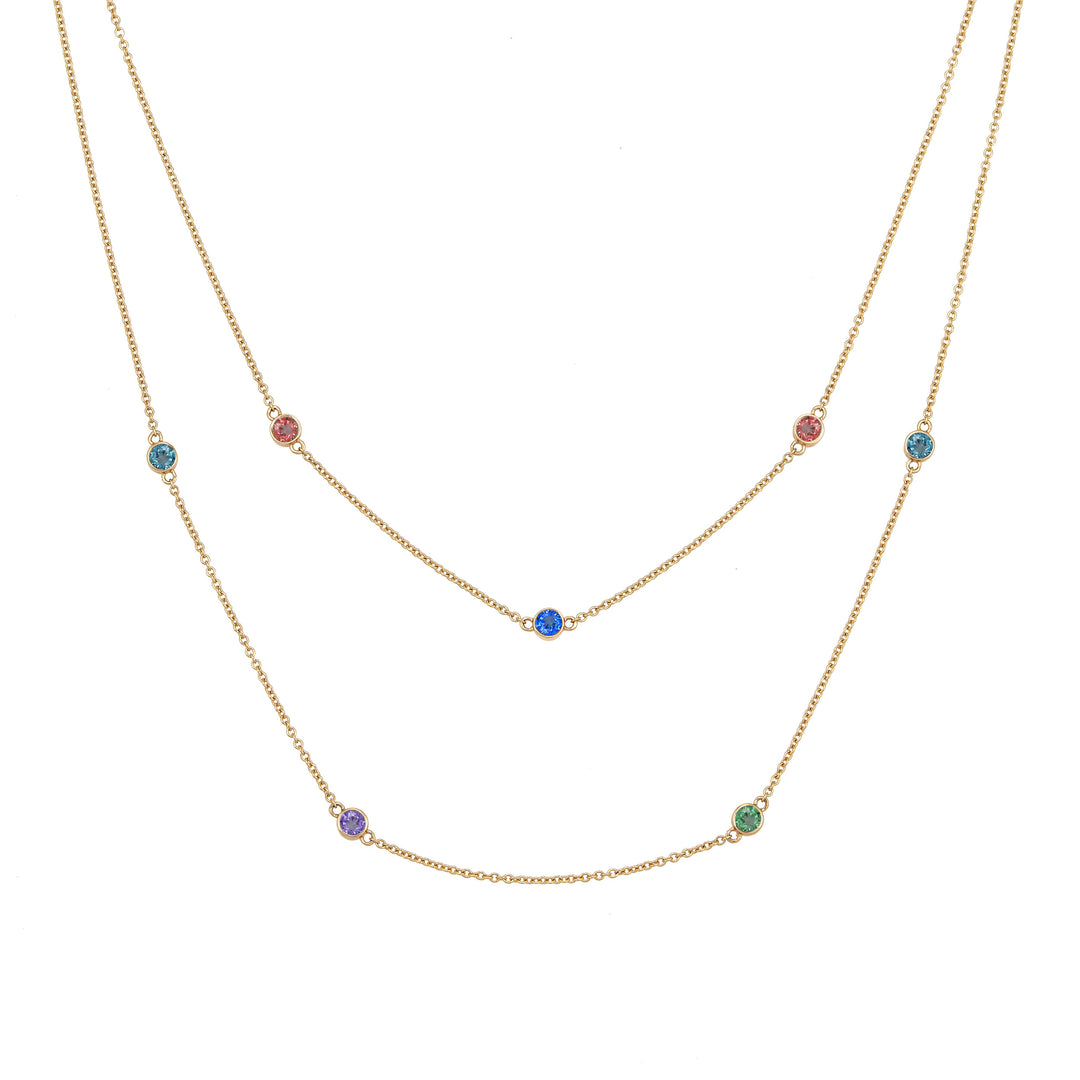 Front of Close By Me's Double Strand Birthstone Necklace in 14K Yellow Gold, set with 7 different gemstones.