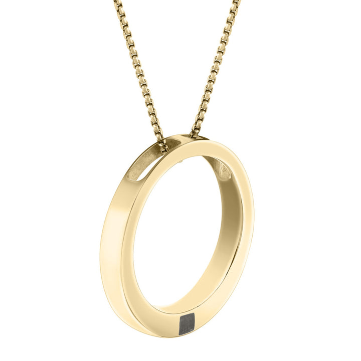 close by me's large open circle cremation pendant in 14k yellow gold hanging on a chain and tilted to the side against a white background