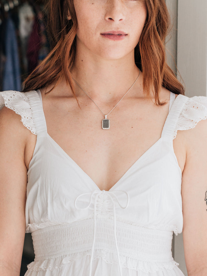 close by me jewelry's sterling silver large cable ashes necklace around a model's neck