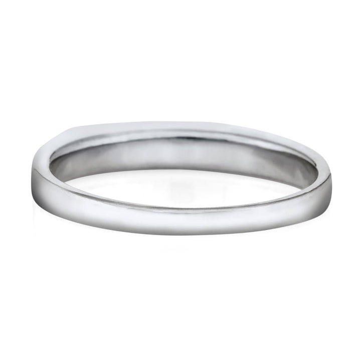 The shank of a 14k white gold smooth band ashes ring made by close by me jewelry