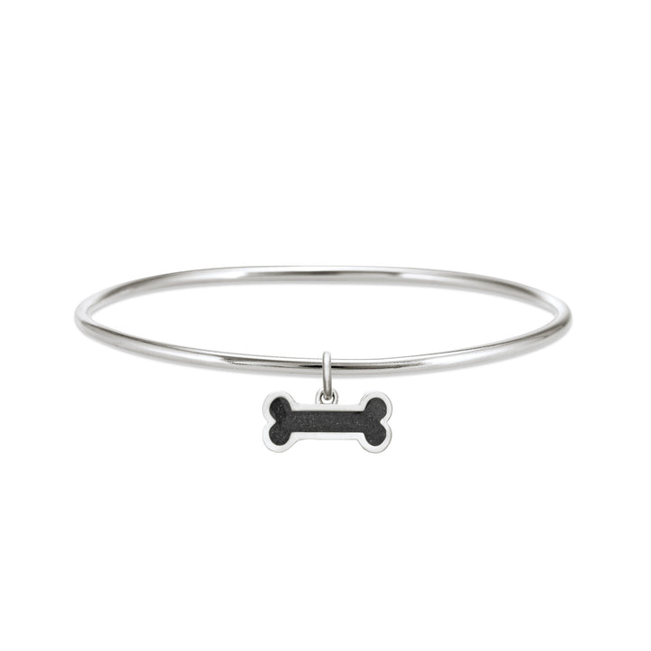 Sterling silver single bangle cremation bracelet with dog bone ashes charm shown from the front