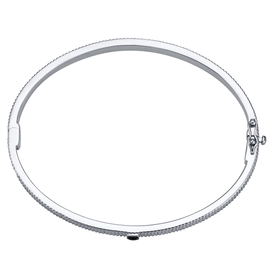 Overhead view of Close By Me's Tessa Bangle Cremation Bracelet in 14K White Gold laying flat and in a closed position against a solid white backdrop.