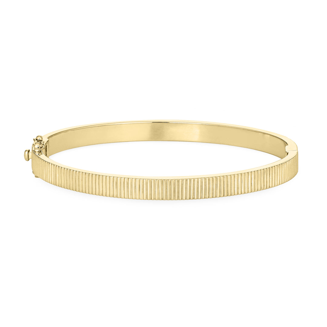 Close By Me's Tessa Bangle Cremation Bracelet in 14K Yellow Gold lays flat and in a closed position with the cremation setting on the side facing away from the camera against a solid white backdrop.