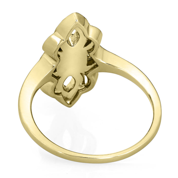 Close-up view of the inside of Close By Me Jewelry's vintage-style World War II Cremation Ring in 14K Yellow Gold with Champagne Diamonds, set against a solid white background. The oval bezel in the center contains solidified cremated remains (not pictured).
