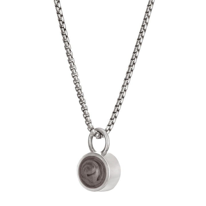 Pictured here is the Bilateral Cremation Necklace in Sterling Silver designed and set with ashes by close by me jewelry at an angle to the left