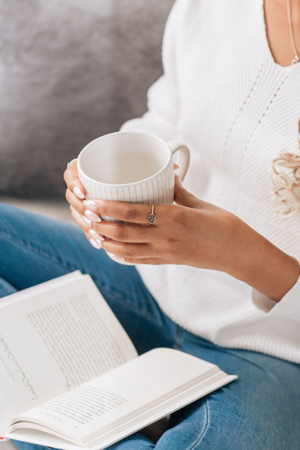 This photo shows a model wearing the 14K Rose Gold Cable Band Ring design by close by me jewelry