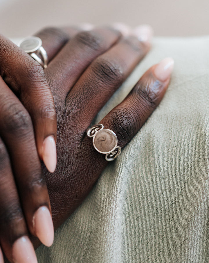 A photo of the Sterling Silver Filigree Heart Band Ring design by close by me being worn on a model's finger