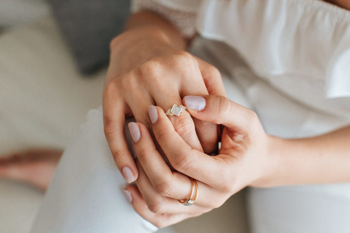 A photo close by me's Kite Setting Champagne Diamond Cluster Ring in 14K Yellow Gold on a model's hand