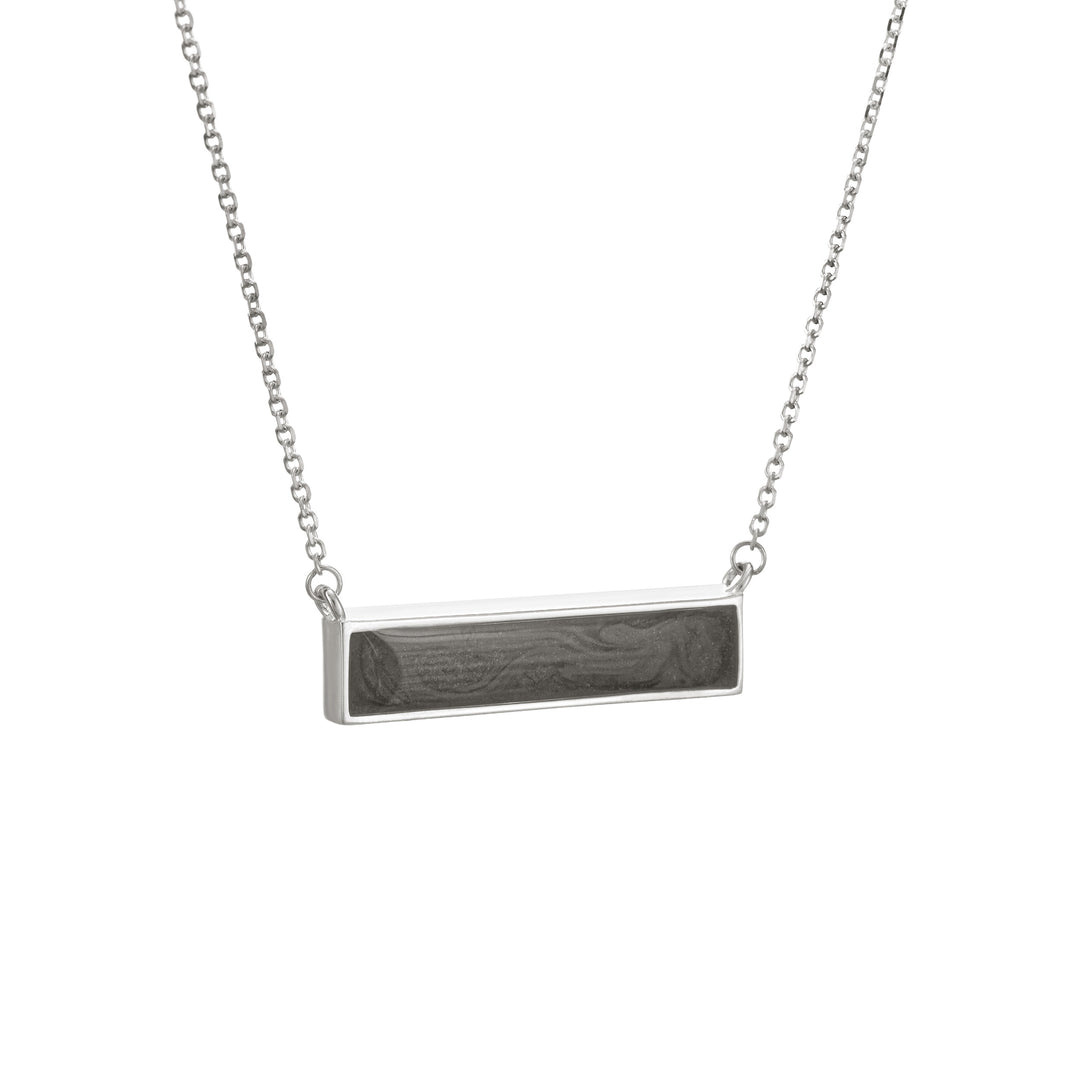 This photo shows close by me jewelry's Sterling Silver Lateral Bar Cremains Necklace from the side