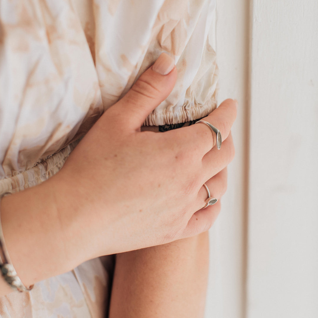 Pictured here is a model wearing close by me's Lateral Marquee Signet Ring design in Sterling Silver at a slight angle