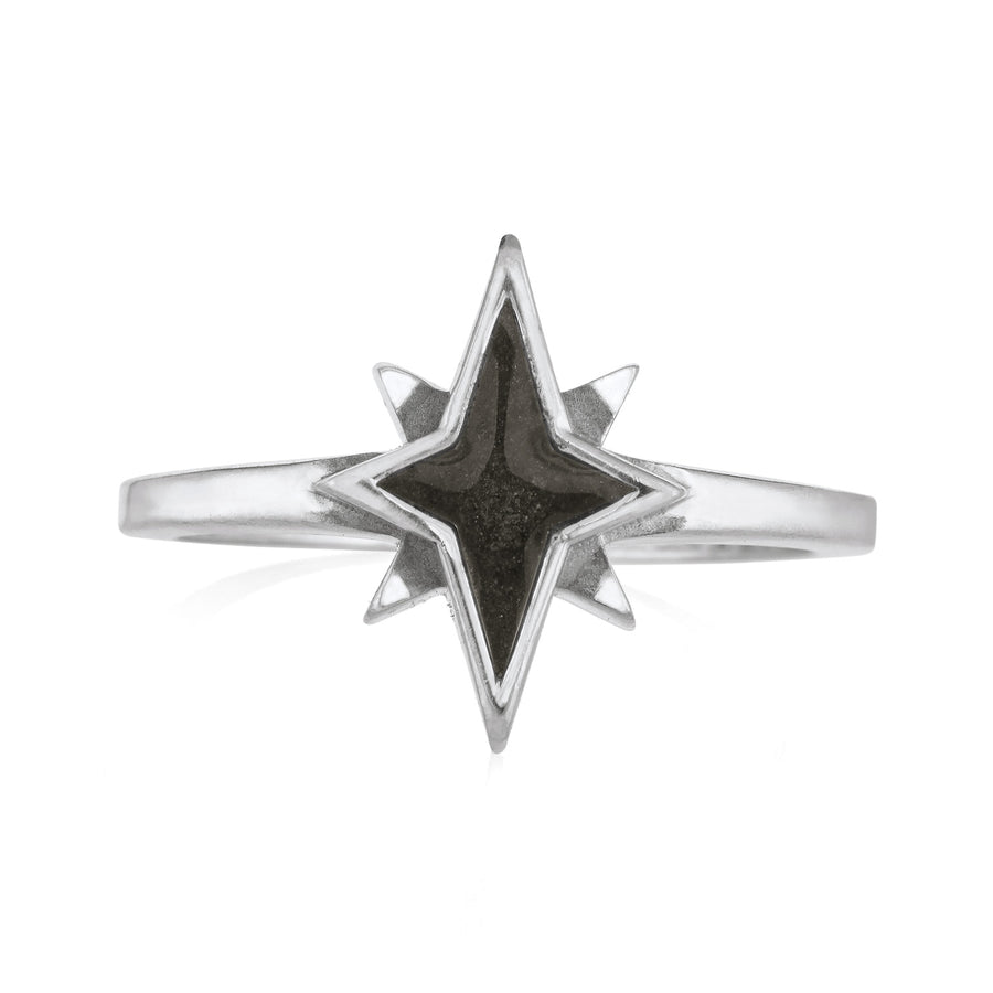 Pictured here is close by me jewelry's 14K White Gold North Star Cremation Ring design from the front to show its dark gray ashes setting