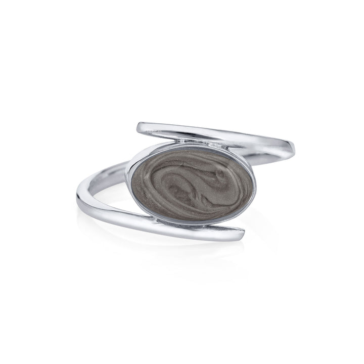 Pictured here is close by me jewelry's Oval Spiral Band Cremation Ring from the front to show its medium gray ashes setting