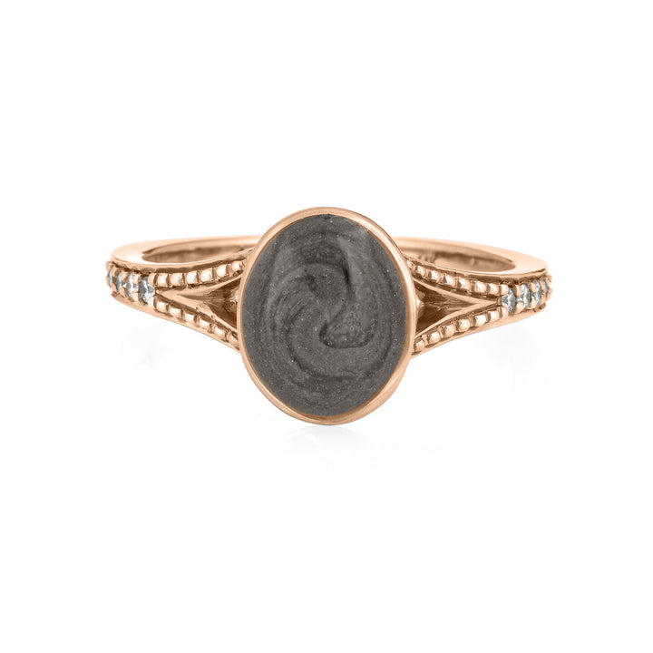 Pictured here is close by me jewelry's 14K Rose Gold Oval Split Shank Champagne Diamond Band Ring from the front with a medium grey ashes setting