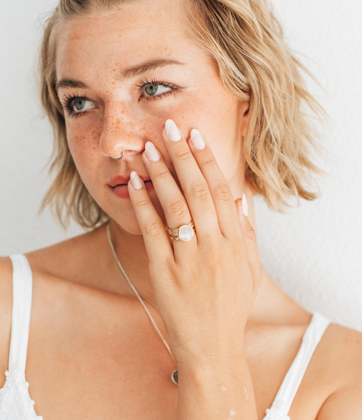 A photo of a model wearing close by me's Textured Band Ring design in Sterling Silver