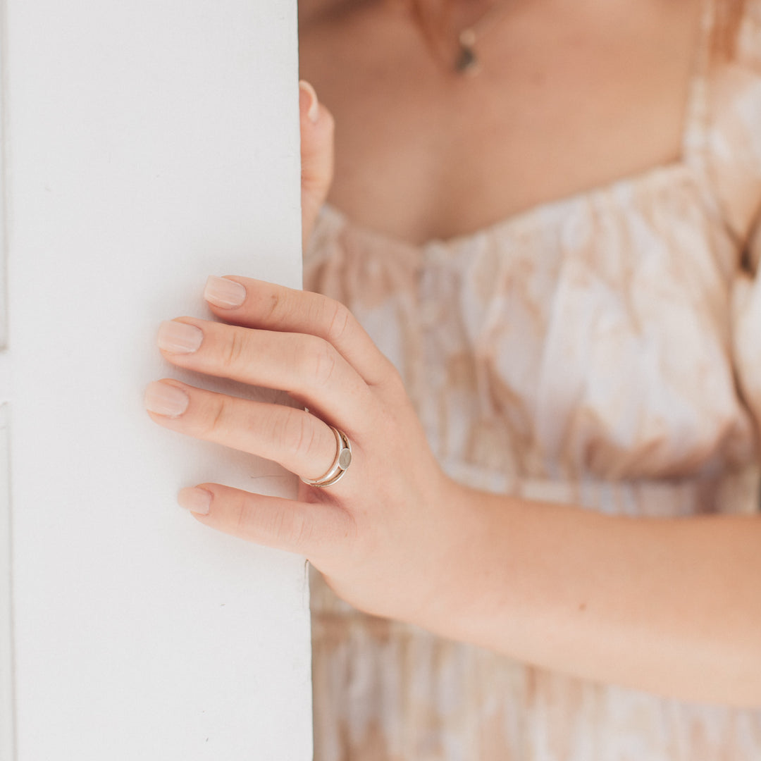 This photo shows the Twin Band Cremation Ring in Sterling Silver designed by close by me jewelry and being worn by a model