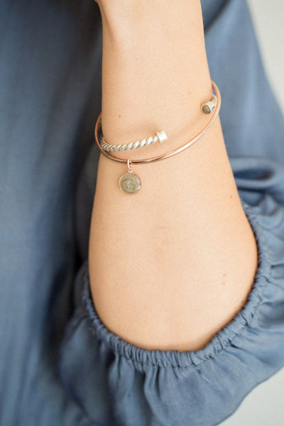 14k Rose Gold Cable Cuff Bracelet on model in blue shirt with other ashes bracelet
