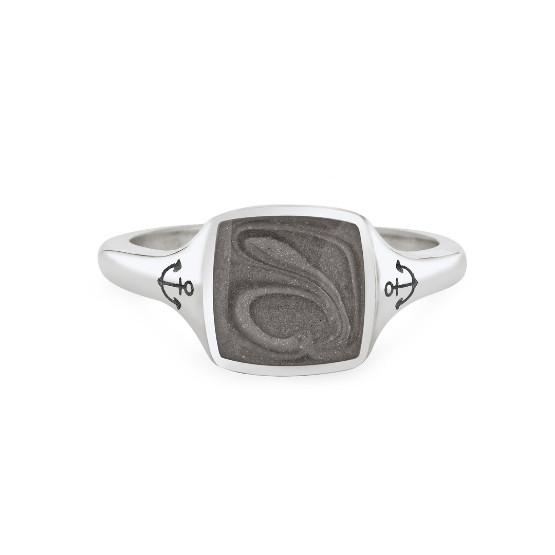 Close By Me's Anchor Signet Cremation Ring in Sterling Silver floats in the center of a solid white background, facing front. The square-shaped cremation setting is dark grey in color and has a bold, visible swirl. The anchor imprints in the band, on either side of the setting, are clearly visible.