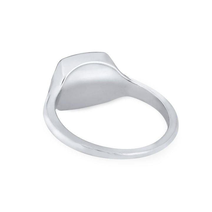 Close By Me's Anchor Signet Cremation Ring in 14K White Gold floats in the center of a solid white background, facing away so that the back of the setting and band of the ring are visible.