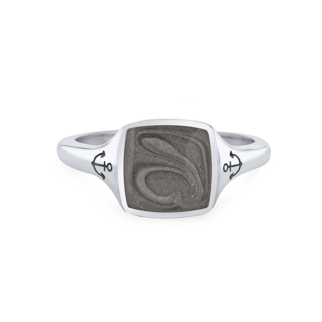 Close By Me's Anchor Signet Cremation Ring in 14K White Gold floats in the center of a solid white background, facing front. The square-shaped cremation setting is dark grey in color and has a bold, visible swirl. The anchor imprints in the band, on either side of the setting, are clearly visible.