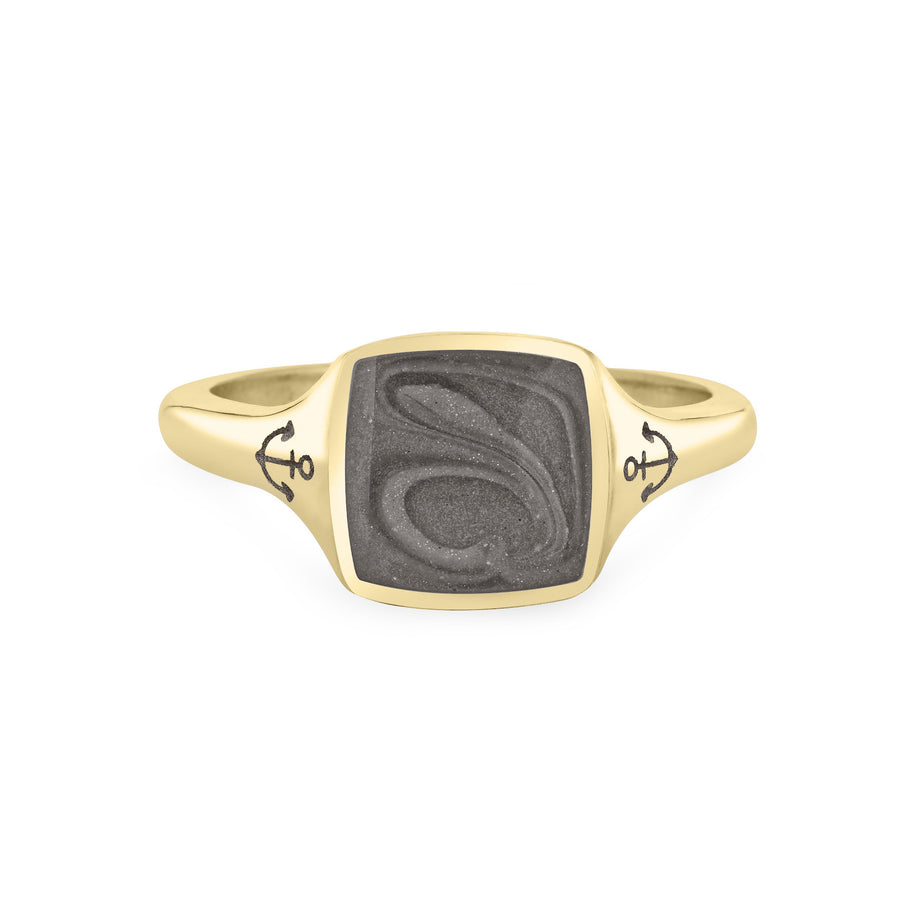 Close By Me's Anchor Signet Cremation Ring in 14K Yellow Gold floats in the center of a solid white background, facing front. The square-shaped cremation setting is dark grey in color and has a bold, visible swirl. The anchor imprints in the band, on either side of the setting, are clearly visible.