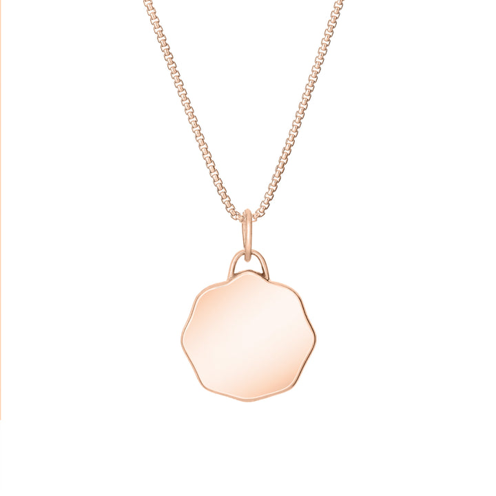Back of Scalloped Coin "Aurea" Cremation Pendant in 14K Rose Gold on a chain against a white background.