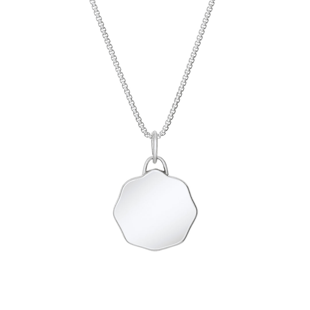 Back of Scalloped Coin "Aurea" Cremation Pendant in Sterling Silver on a chain against a white background.