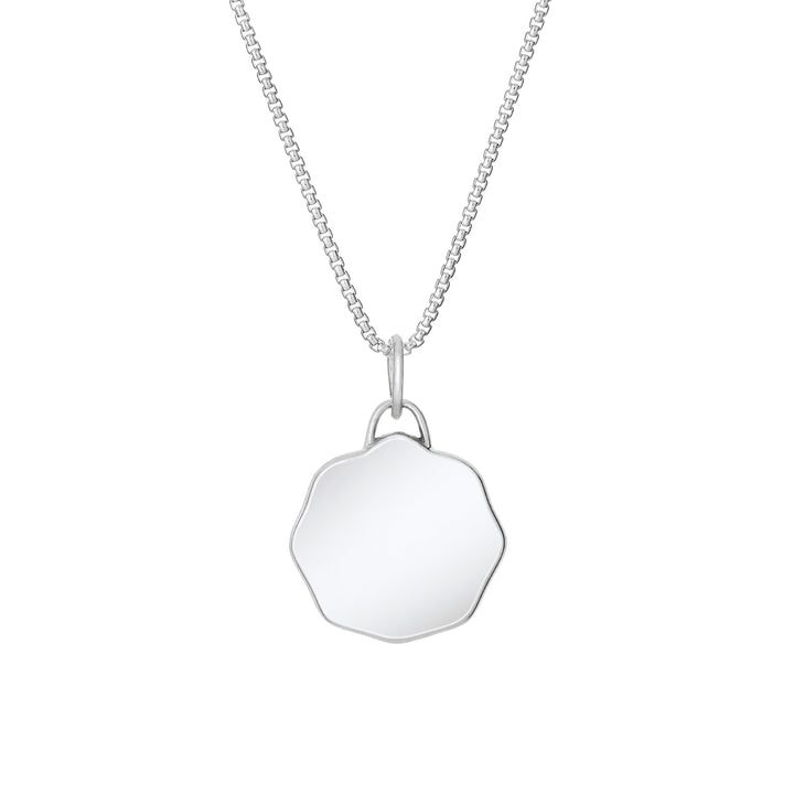 Back of Scalloped Coin "Aurea" Cremation Pendant in Sterling Silver on a chain against a white background.
