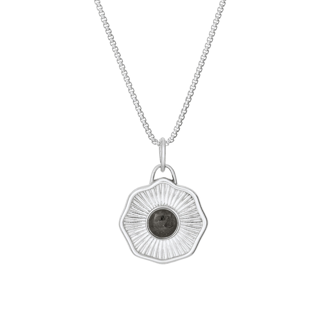 Front of Scalloped Coin "Aurea" Cremation Pendant in Sterling Silver on a chain against a white background.
