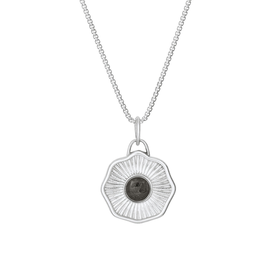 Front of Scalloped Coin "Aurea" Cremation Pendant in Sterling Silver on a chain against a white background.
