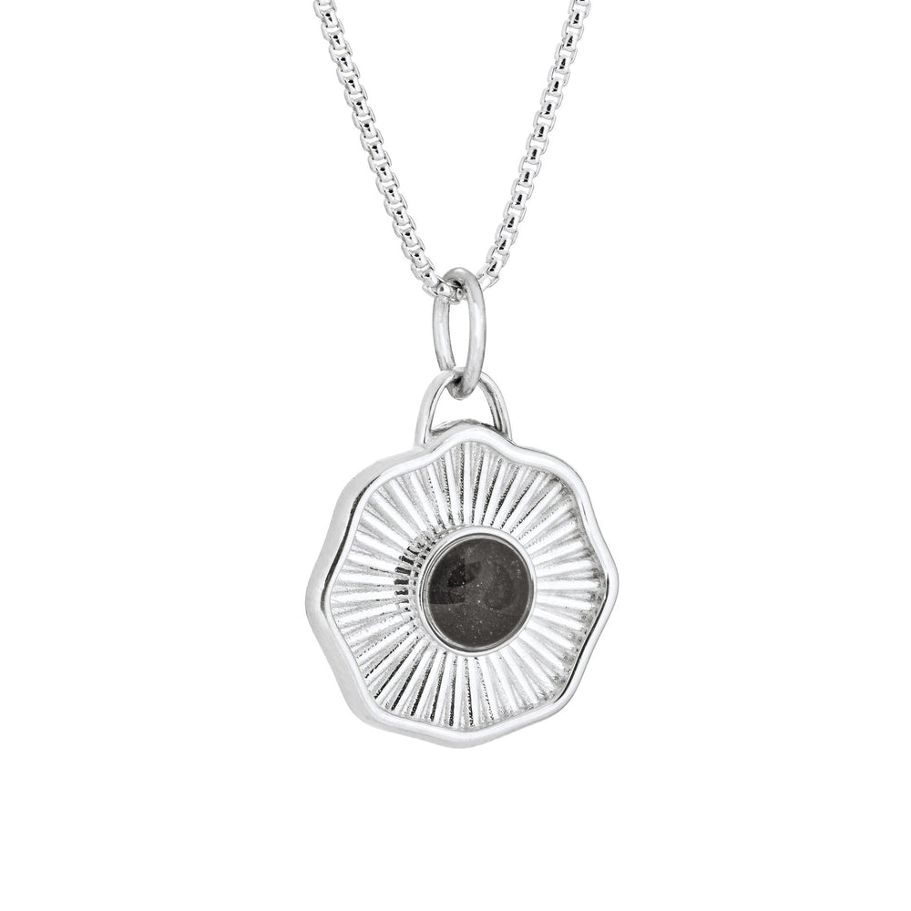 Side of Scalloped Coin "Aurea" Cremation Pendant in Sterling Silver on a chain against a white background.