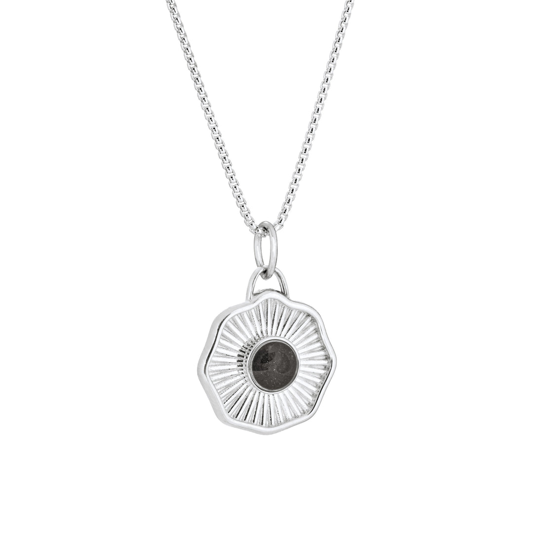 Side of Scalloped Coin "Aurea" Cremation Pendant in Sterling Silver on a chain against a white background.