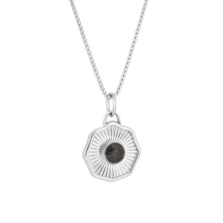 Side of Scalloped Coin "Aurea" Cremation Pendant in Sterling Silver on a chain against a white background.
