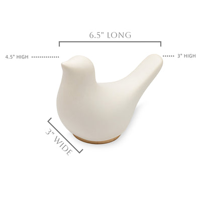 A partially overhead view of Close By Me's Ceramic Bird Urn facing to the left against a solid white background with its various measurements indicated.