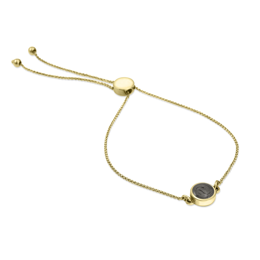 Bolo Chain Ashes Bracelet in 14k Yellow Gold, laying down on surface with all white background.