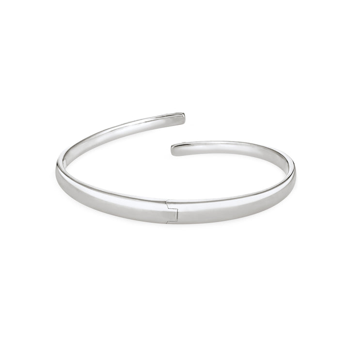 Back view of Close By Me's Sterling Silver Bypass Hinged Cuff Cremation Bracelet, centered in a solid white square.