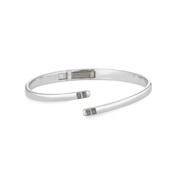 Front view of Close By Me's Sterling Silver Bypass Hinged Cuff Cremation Bracelet, centered in a solid white square.
