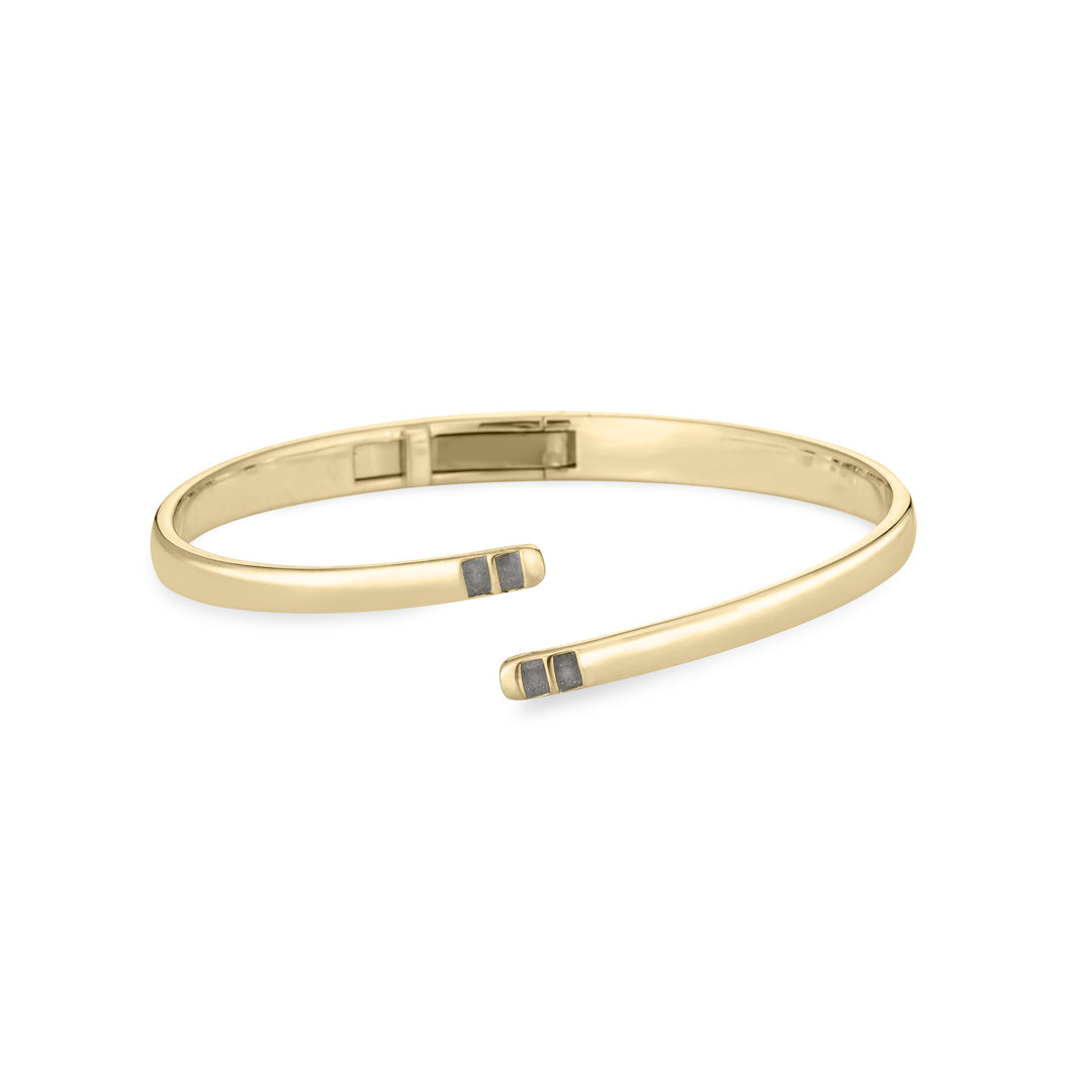 Front view of Close By Me's 14K Yellow Gold Bypass Hinged Cuff Cremation Bracelet, centered in a solid white square.