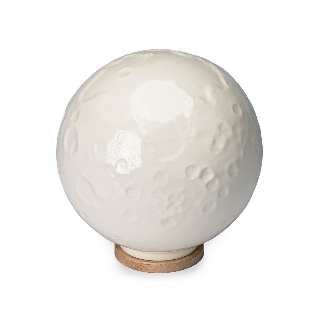 The near side of Close By Me's Ceramic Moon Keepsake Urn.