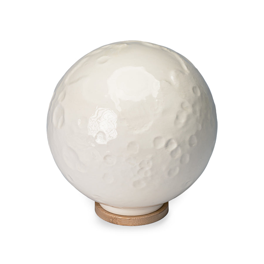The near side of Close By Me's Ceramic Moon Keepsake Urn.