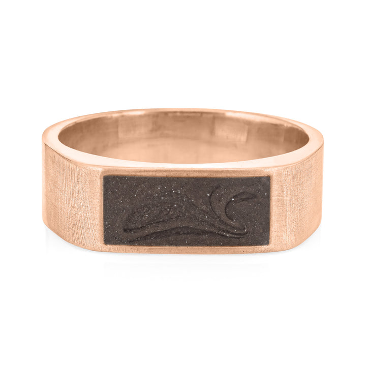 Pictured here is close by me jewelry's Men's Classic Band Cremation Ring design in 14K Rose Gold from the front to show its dark grey ashes setting