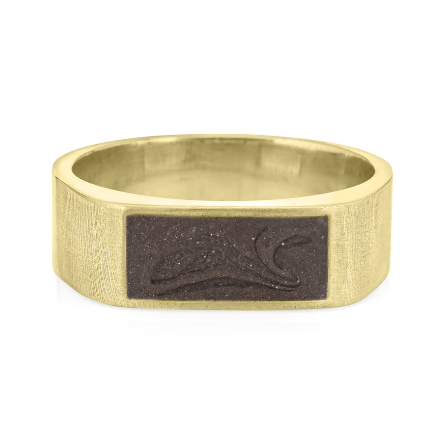 Pictured here is close by me jewelry's Men's Classic Band Cremation Ring design in 14K Yellow Gold from the front to show its dark grey ashes setting