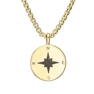 A close-up, front view of Close By Me's Compass Cremation Pendant in 14K Yellow Gold, with a shiny finish, on a thick chain.