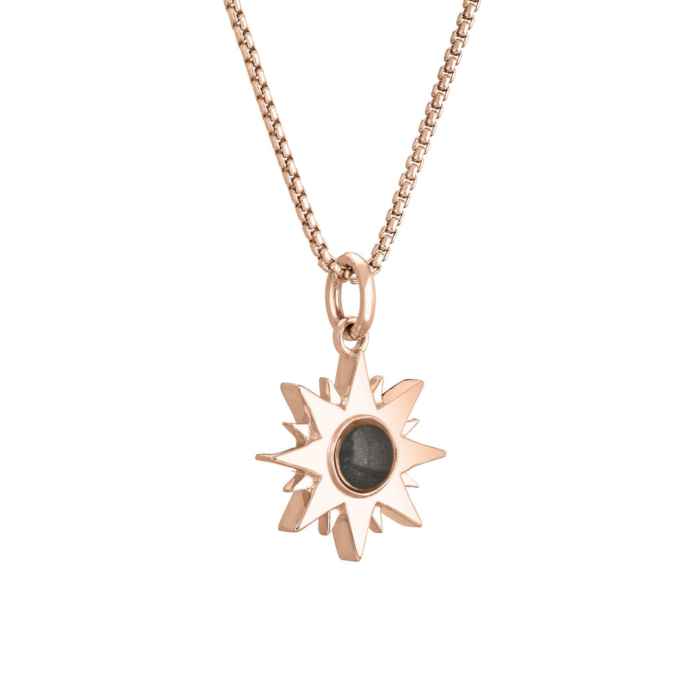 Side of Dainty Sun Cremation Pendant in 14K Rose Gold on a chain against a white background.