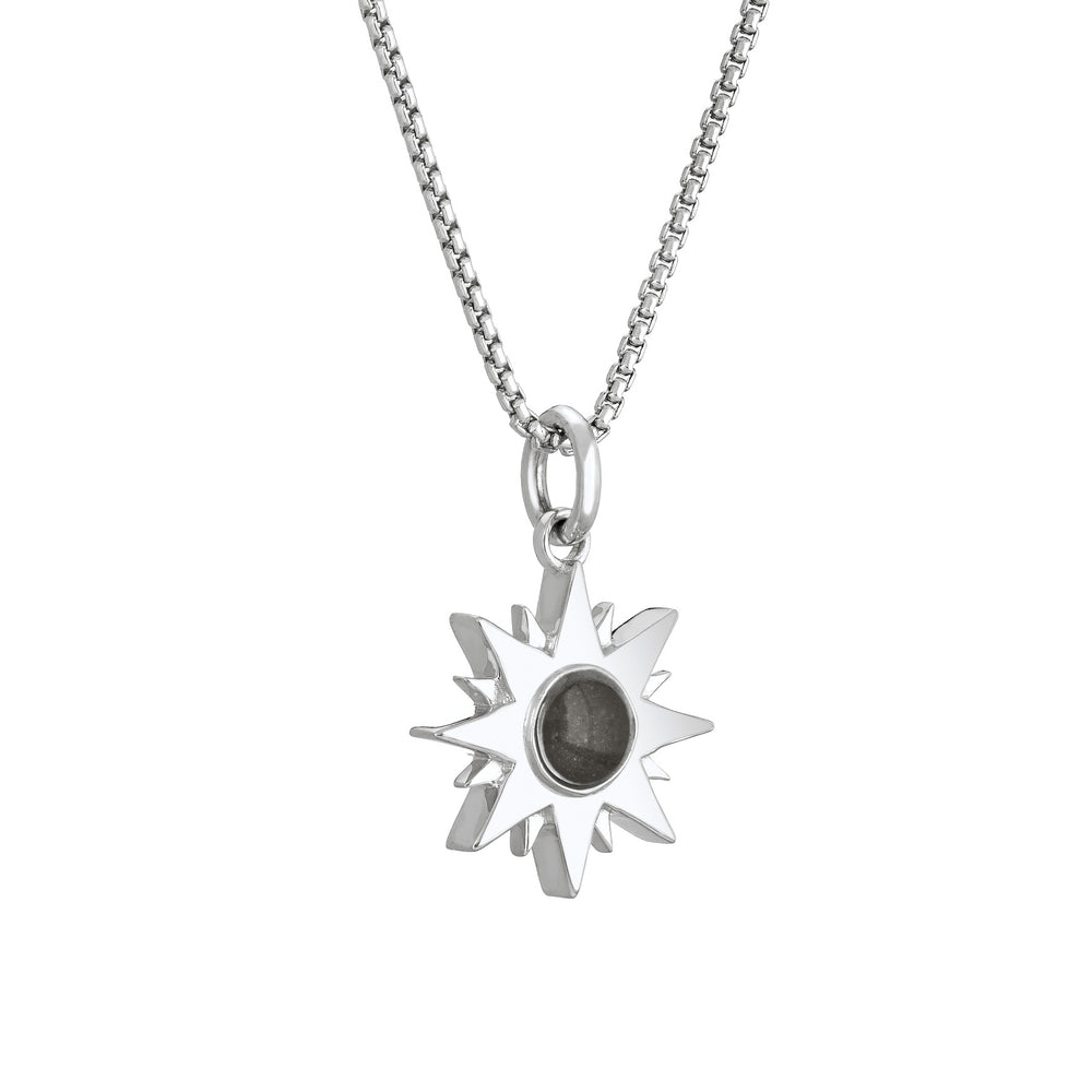 Side of Dainty Sun Cremation Pendant in Sterling Silver on a chain against a white background.