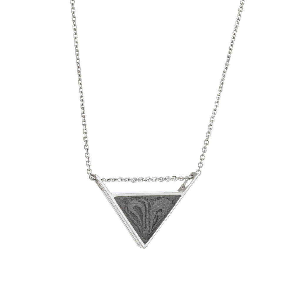 A slightly angled view of the detailed triangle sliding pendant with ashes created by close by me jewelry