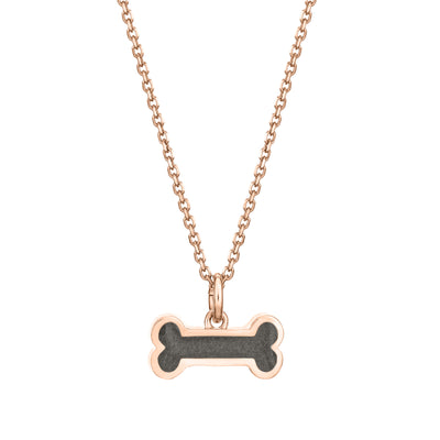 Pictured here is the Dog Bone Pendant with ashes in 14K Rose Gold, designed by close by me jewelry, from the front