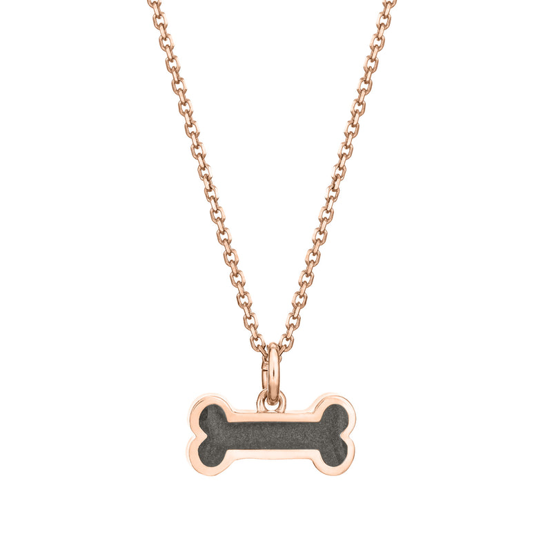 Pictured here is the Dog Bone Pendant with ashes in 14K Rose Gold, designed by close by me jewelry, from the front